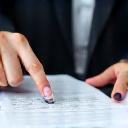 Person reviewing a document, representing proposal development