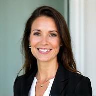 Professional headshot of Eliza Bennett